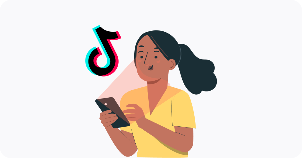 A woman looking to a mobile phone next to a TikTok logo. 