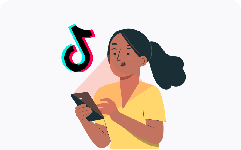 A woman looking to a phone next to a TikTok logo.